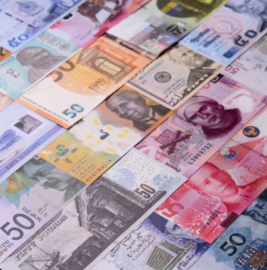 Paper money, banknotes of different countries in several denominations as a business background. Paper money and cash as a financial background for your design.