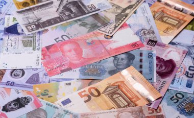 Paper money, banknotes of different countries in several denominations as a business background. Paper money and cash as a financial background for your design.