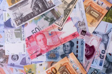 Paper money, banknotes of different countries in several denominations as a business background. Paper money and cash as a financial background for your design.