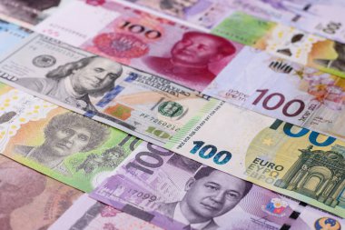 Paper money, banknotes of different countries in several denominations as a business background. Paper money and cash as a financial background for your design.