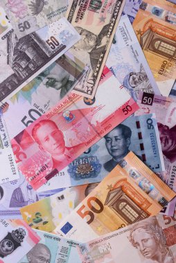 Paper money, banknotes of different countries in several denominations as a business background. Paper money and cash as a financial background for your design.