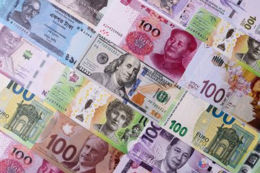 Paper money, banknotes of different countries in several denominations as a business background. Paper money and cash as a financial background for your design.