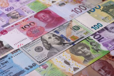 Paper money, banknotes of different countries in several denominations as a business background. Paper money and cash as a financial background for your design.
