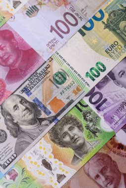 Paper money, banknotes of different countries in several denominations as a business background. Paper money and cash as a financial background for your design.