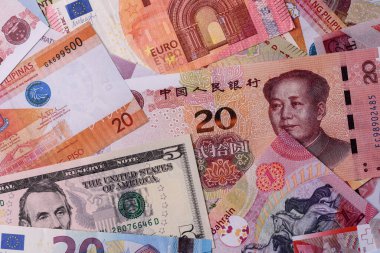 Paper money, banknotes of different countries in several denominations as a business background. Paper money and cash as a financial background for your design.