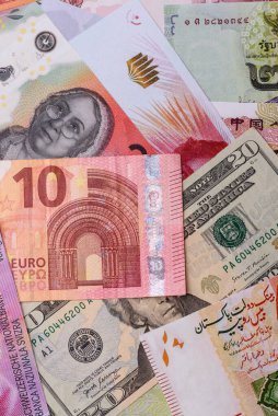 Paper money, banknotes of different countries in several denominations as a business background. Paper money and cash as a financial background for your design.