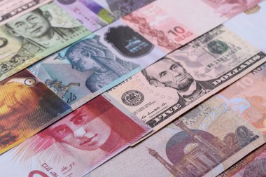 Paper money, banknotes of different countries in several denominations as a business background. Paper money and cash as a financial background for your design.