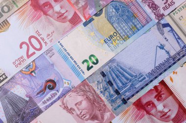 Paper money, banknotes of different countries in several denominations as a business background. Paper money and cash as a financial background for your design.