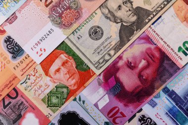Paper money, banknotes of different countries in several denominations as a business background. Paper money and cash as a financial background for your design.