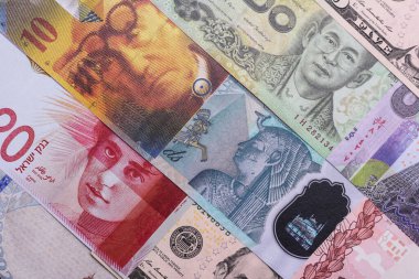 Paper money, banknotes of different countries in several denominations as a business background. Paper money and cash as a financial background for your design.