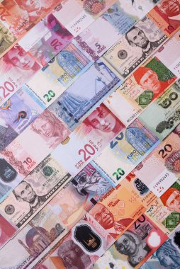 Paper money, banknotes of different countries in several denominations as a business background. Paper money and cash as a financial background for your design.