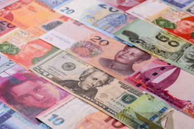 Paper money, banknotes of different countries in several denominations as a business background. Paper money and cash as a financial background for your design.