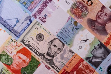 Paper money, banknotes of different countries in several denominations as a business background. Paper money and cash as a financial background for your design.