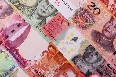 Paper money, banknotes of different countries in several denominations as a business background. Paper money and cash as a financial background for your design.