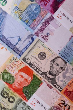 Paper money, banknotes of different countries in several denominations as a business background. Paper money and cash as a financial background for your design.