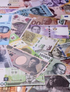Paper money, banknotes of different countries in several denominations as a business background. Paper money and cash as a financial background for your design.