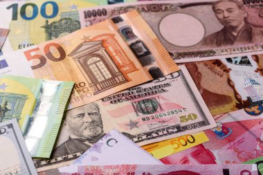 Paper money, banknotes of different countries in several denominations as a business background. Paper money and cash as a financial background for your design.