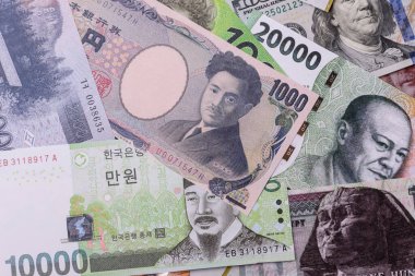 Paper money, banknotes of different countries in several denominations as a business background. Paper money and cash as a financial background for your design.