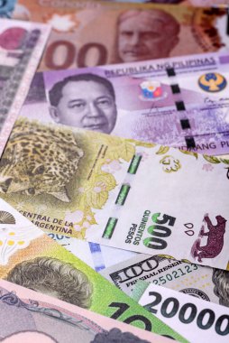 Paper money, banknotes of different countries in several denominations as a business background. Paper money and cash as a financial background for your design.