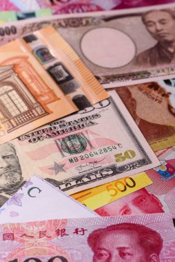 Paper money, banknotes of different countries in several denominations as a business background. Paper money and cash as a financial background for your design.