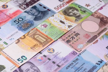 Paper money, banknotes of different countries in several denominations as a business background. Paper money and cash as a financial background for your design.
