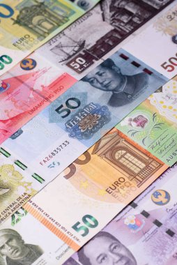 Paper money, banknotes of different countries in several denominations as a business background. Paper money and cash as a financial background for your design.