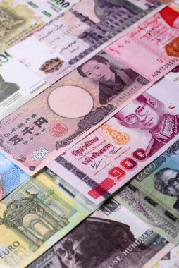 Paper money, banknotes of different countries in several denominations as a business background. Paper money and cash as a financial background for your design.