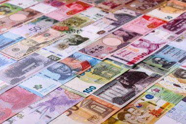 Paper money, banknotes of different countries in several denominations as a business background. Paper money and cash as a financial background for your design.