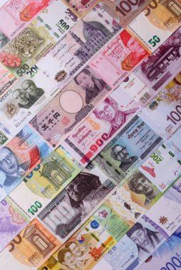 Paper money, banknotes of different countries in several denominations as a business background. Paper money and cash as a financial background for your design.
