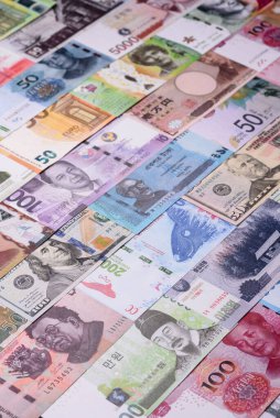Paper money, banknotes of different countries in several denominations as a business background. Paper money and cash as a financial background for your design.
