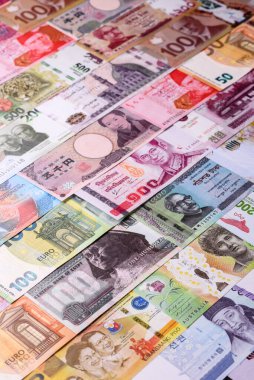 Paper money, banknotes of different countries in several denominations as a business background. Paper money and cash as a financial background for your design.