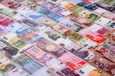 Paper money, banknotes of different countries in several denominations as a business background. Paper money and cash as a financial background for your design.