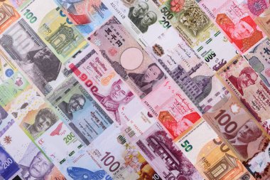 Paper money, banknotes of different countries in several denominations as a business background. Paper money and cash as a financial background for your design.