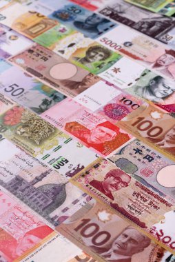 Paper money, banknotes of different countries in several denominations as a business background. Paper money and cash as a financial background for your design.