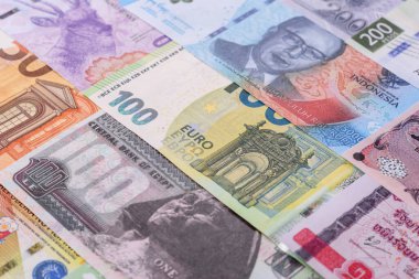 Paper money, banknotes of different countries in several denominations as a business background. Paper money and cash as a financial background for your design.