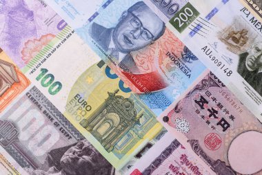 Paper money, banknotes of different countries in several denominations as a business background. Paper money and cash as a financial background for your design.