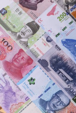 Paper money, banknotes of different countries in several denominations as a business background. Paper money and cash as a financial background for your design.
