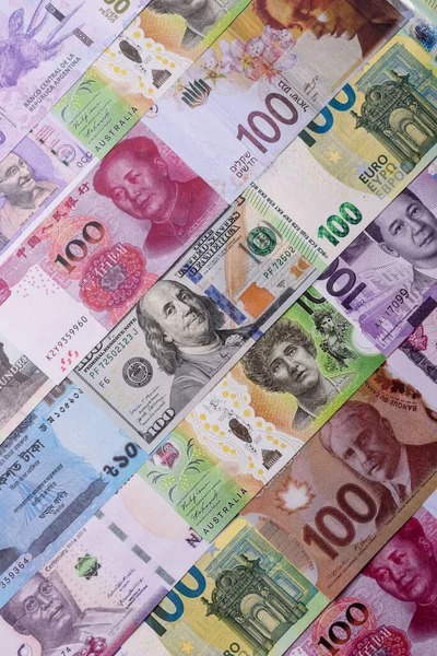 Paper money, banknotes of different countries in several denominations as a business background. Paper money and cash as a financial background for your design.