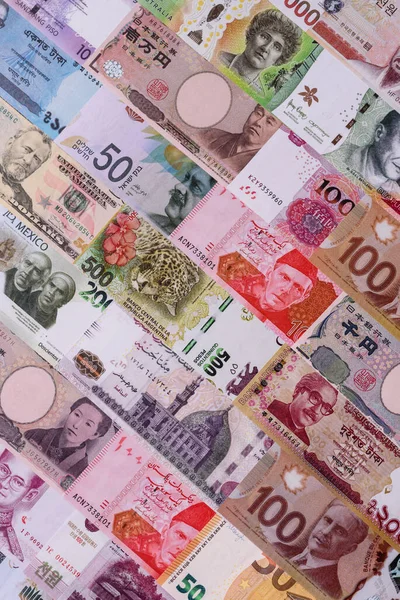 Paper money, banknotes of different countries in several denominations as a business background. Paper money and cash as a financial background for your design.