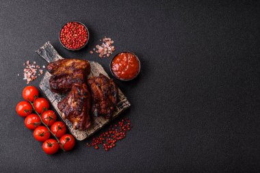 Grilled or barbecued pork ribs with sauce. Grilled ribs as a food background for your design.