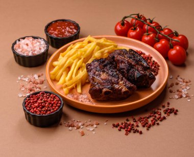 Grilled or barbecued pork ribs with sauce. Grilled ribs as a food background for your design.