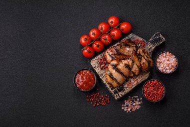 Chicken breast cooked on a grill or barbecue with sauce. Grilled chicken as a food backdrop for your design