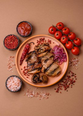 Chicken breast cooked on a grill or barbecue with sauce. Grilled chicken as a food backdrop for your design