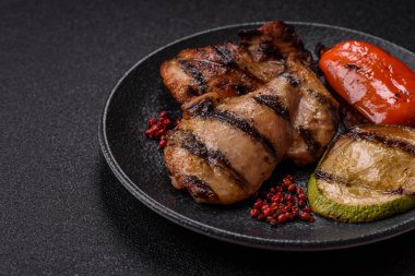 Chicken breast cooked on a grill or barbecue with sauce. Grilled chicken as a food backdrop for your design