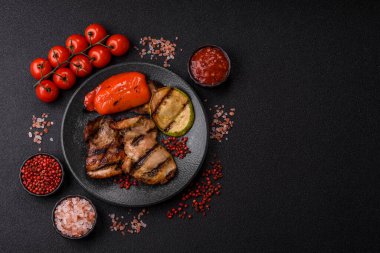 Chicken breast cooked on a grill or barbecue with sauce. Grilled chicken as a food backdrop for your design