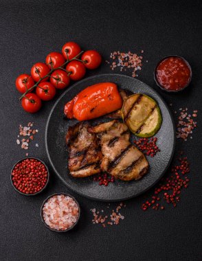 Chicken breast cooked on a grill or barbecue with sauce. Grilled chicken as a food backdrop for your design