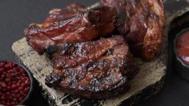 Grilled or barbecued pork ribs with sauce. Grilled ribs as a food background for your design.