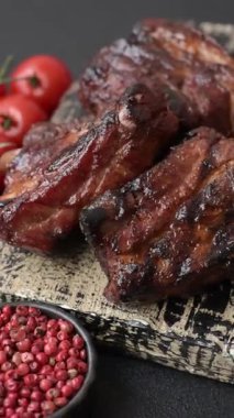 Grilled or barbecued pork ribs with sauce. Grilled ribs as a food background for your design.