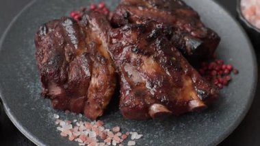 Grilled or barbecued pork ribs with sauce. Grilled ribs as a food background for your design.