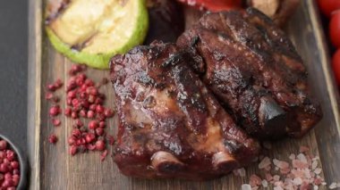 Grilled or barbecued pork ribs with sauce. Grilled ribs as a food background for your design.